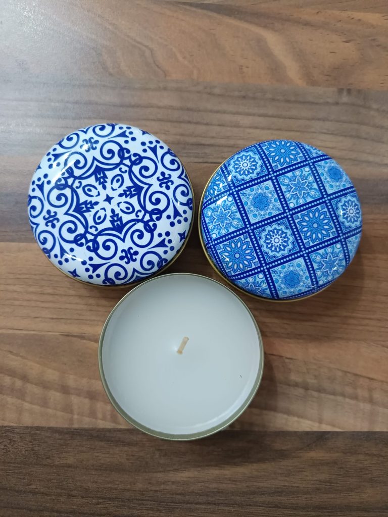 Candle in patterned tin